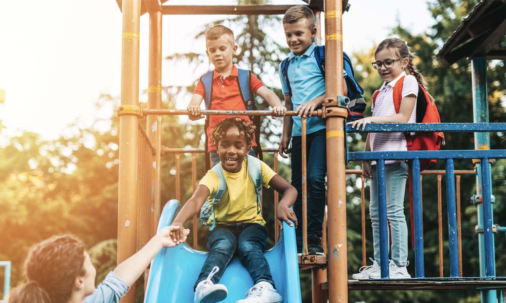 Keep Your Child Safe on Outdoor Play Equipment - Group of Children Playing at a Playground at Sunset