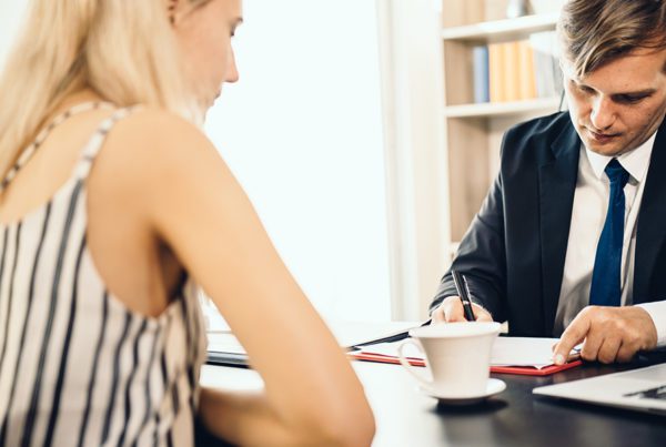 Blog - Professional Discussing Fraud Portection in the Office with a Client