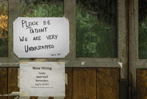 Blog - Please Be Patient We are Very Understaffed Sign Outside of Business with a Now Hiring Sign Under it