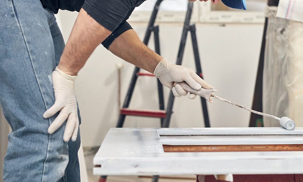 Blog - Man Painting a Door Frame White in His Home for his Home Renovations
