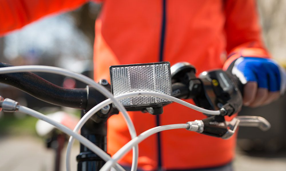 Blog - Closeup of a Front White Reflector on Bike