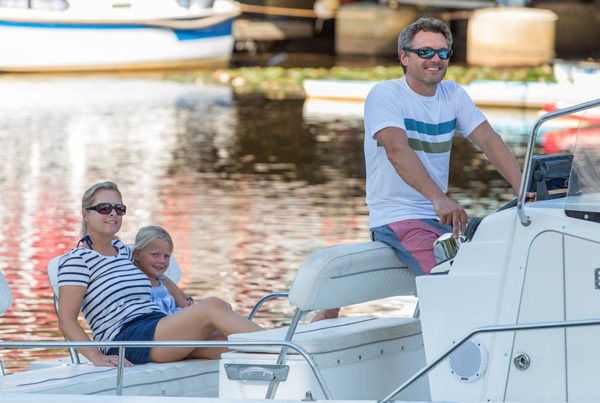 Blog - Family Enjoying a Ride on Their Boat While on Vacation
