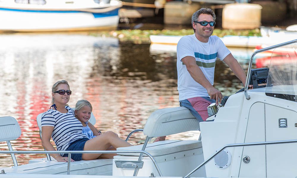 Blog - Family Enjoying a Ride on Their Boat While on Vacation